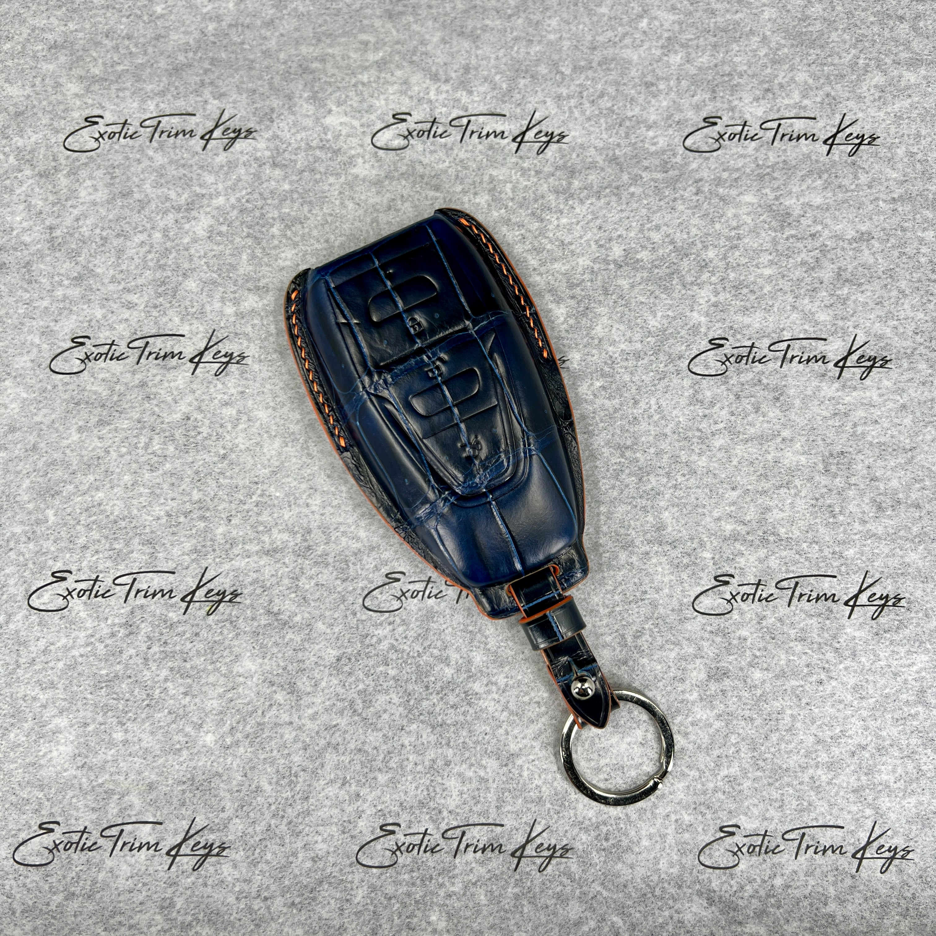 IN STOCK: NAVY BLUE CROCODILE WITH ORANGE DETAILS KEY COVER FOR ASTON MARTIN