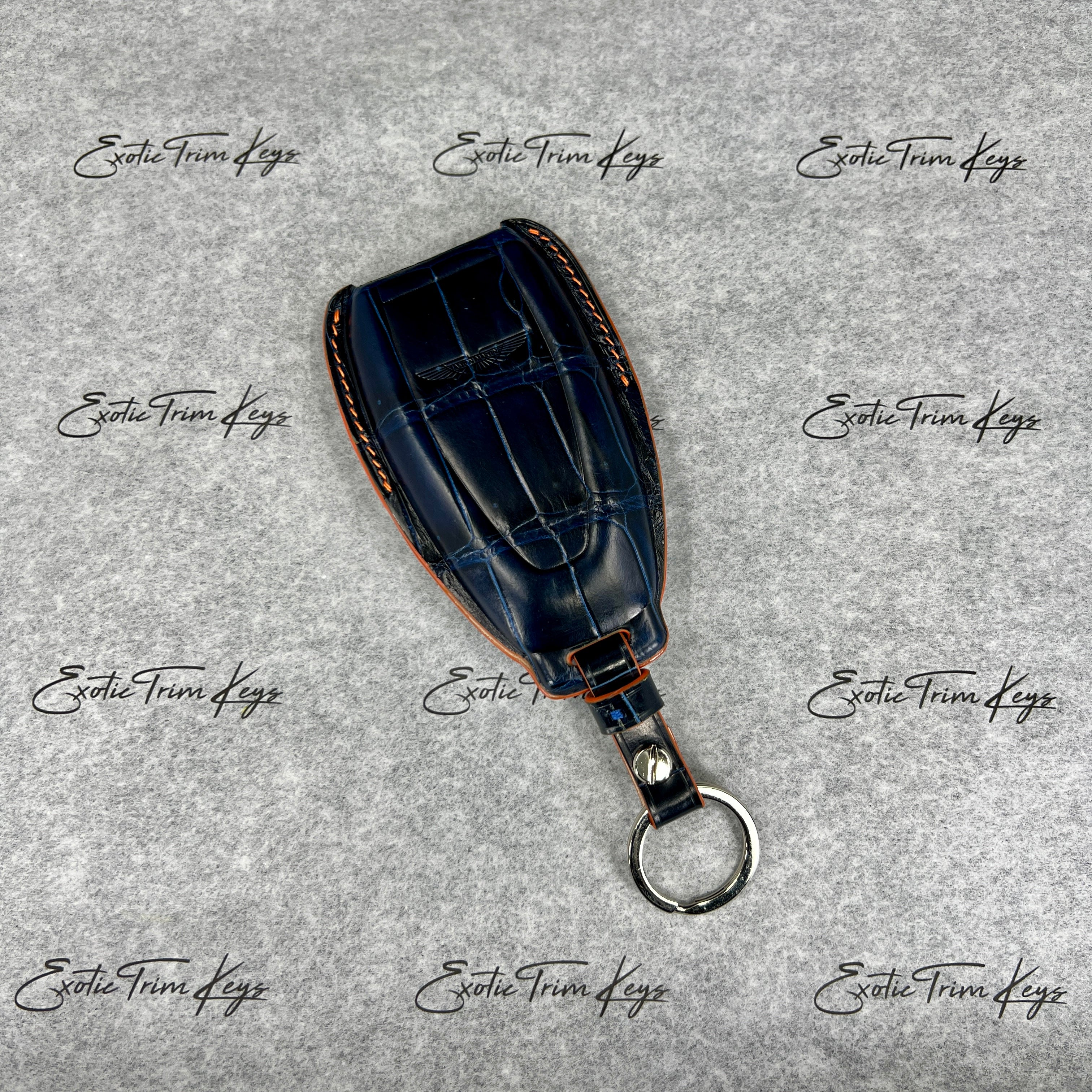 IN STOCK: NAVY BLUE CROCODILE WITH ORANGE DETAILS KEY COVER FOR ASTON MARTIN