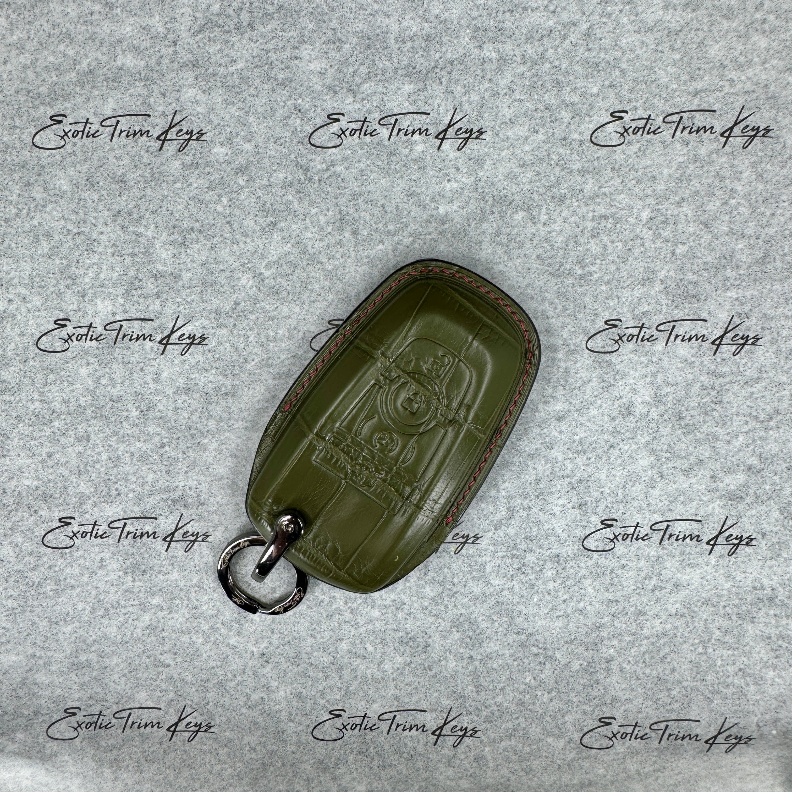 IN STOCK: OLIVE GREEN CROCODILE WITH RED & BLACK DETAILS KEY COVER FOR RAPTOR
