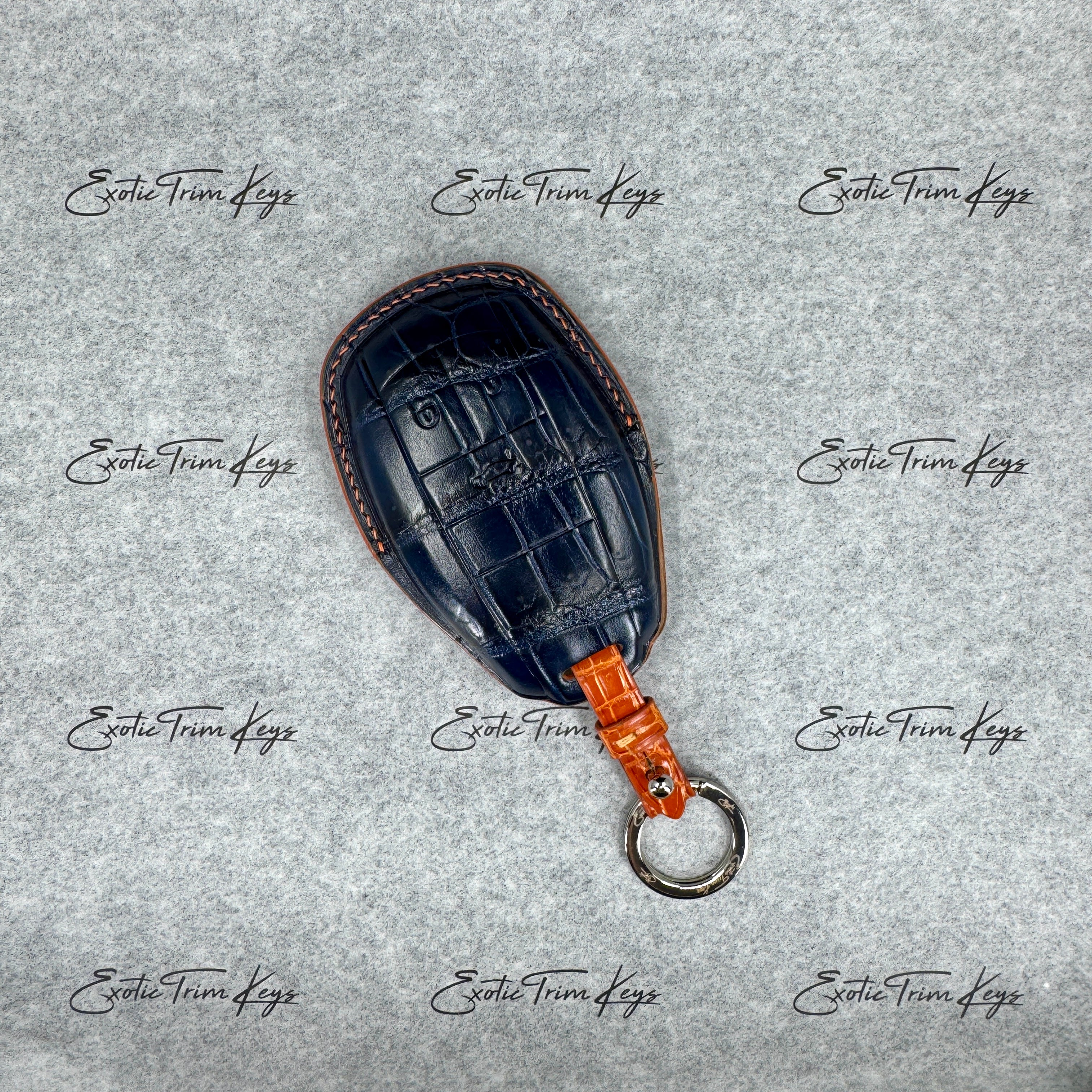 IN STOCK: NAVY BLUE CROCODILE WITH ORANGE DETAILS KEY COVER FOR BENTLEY